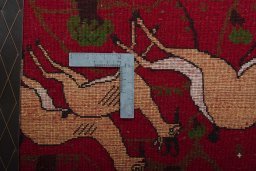 Backside of handmade 2000s Shiraz rug showing knot structure and weave density