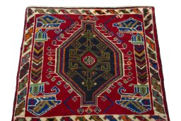 Surface texture of 2000s Shiraz rug with natural Wool and intricate pattern