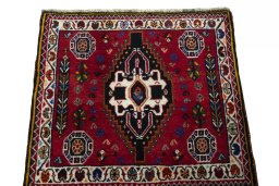 Surface texture of 2000s Shiraz rug with natural Wool and intricate pattern