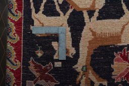 Backside of handmade 2000s Shiraz rug showing knot structure and weave density