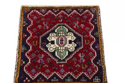 Surface texture of 2000s Shiraz rug with natural Wool and intricate pattern
