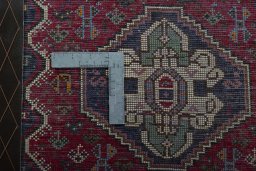 Backside of handmade 2000s Shiraz rug showing knot structure and weave density