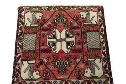 Surface texture of 2000s Shiraz rug with natural Wool and intricate pattern