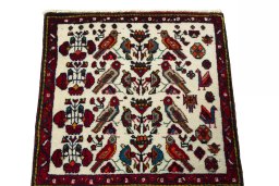 Surface texture of 2000s Shiraz rug with natural Wool and intricate pattern