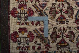Backside of handmade 2000s Shiraz rug showing knot structure and weave density
