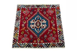 Surface texture of 2000s Shiraz rug with natural Wool and intricate pattern