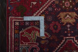 Corner detail of 2000s Shiraz rug showing border pattern and Wool pile