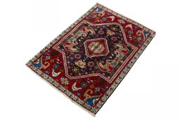 Corner detail of 2000s Shiraz rug showing border pattern and Wool pile