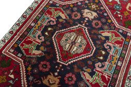Backside of handmade 2000s Shiraz rug showing knot structure and weave density