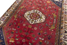 Backside of handmade 1970s Shiraz rug showing knot structure and weave density