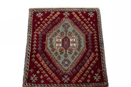 Surface texture of 2000s Shiraz rug with natural Wool and intricate pattern