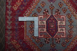 Backside of handmade 2000s Shiraz rug showing knot structure and weave density