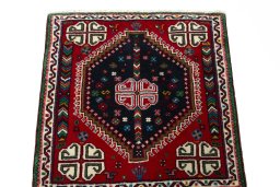Surface texture of 2000s Shiraz rug with natural Wool and intricate pattern