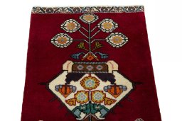 Surface texture of 2000s Shiraz rug with natural Wool and intricate pattern