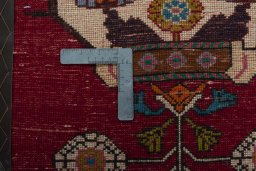 Backside of handmade 2000s Shiraz rug showing knot structure and weave density