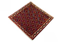 Corner detail of 2000s Shiraz rug showing border pattern and Wool pile