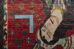 Backside of handmade 2000s Shiraz rug showing knot structure and weave density