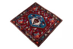Corner detail of 2000s Shiraz rug showing border pattern and Wool pile