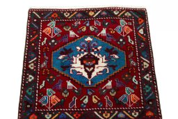 Surface texture of 2000s Shiraz rug with natural Wool and intricate pattern