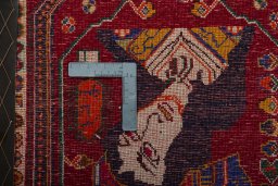 Backside of handmade 2000s Shiraz rug showing knot structure and weave density