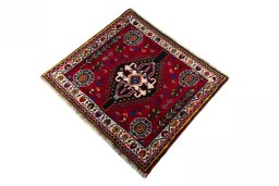 Corner detail of 2000s Shiraz rug showing border pattern and Wool pile