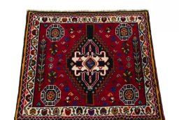Surface texture of 2000s Shiraz rug with natural Wool and intricate pattern