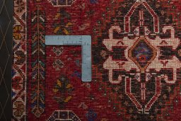 Backside of handmade 2000s Shiraz rug showing knot structure and weave density