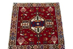 Surface texture of 2000s Shiraz rug with natural Wool and intricate pattern
