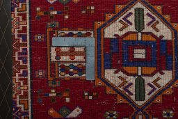 Backside of handmade 2000s Shiraz rug showing knot structure and weave density