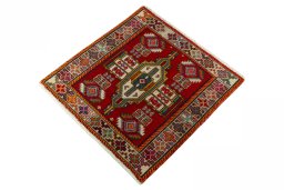 Corner detail of 2000s Shiraz rug showing border pattern and Wool pile