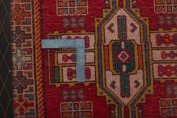 Backside of handmade 2000s Shiraz rug showing knot structure and weave density