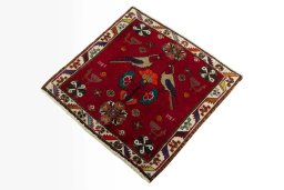 Corner detail of 2000s Shiraz rug showing border pattern and Wool pile