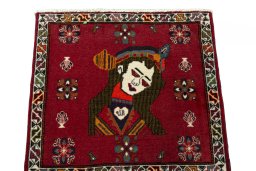 Surface texture of 2000s Shiraz rug with natural Wool and intricate pattern