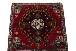 Surface texture of 2000s Shiraz rug with natural Wool and intricate pattern