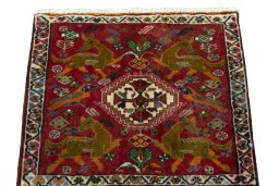 Surface texture of 2000s Shiraz rug with natural Wool and intricate pattern