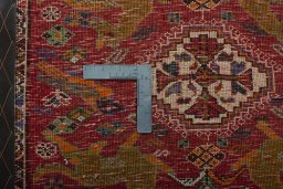 Backside of handmade 2000s Shiraz rug showing knot structure and weave density