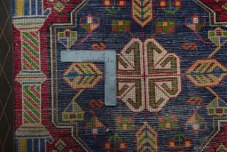 Backside of handmade 2000s Shiraz rug showing knot structure and weave density
