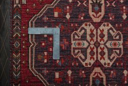 Backside of handmade 2000s Shiraz rug showing knot structure and weave density