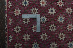 Backside of handmade 2000s Shiraz rug showing knot structure and weave density