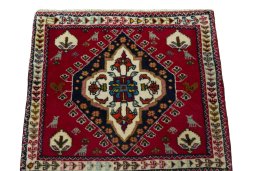 Surface texture of 2000s Shiraz rug with natural Wool and intricate pattern