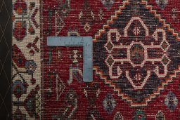 Backside of handmade 2000s Shiraz rug showing knot structure and weave density