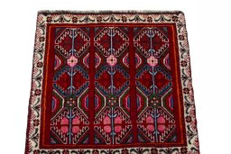 Surface texture of 2000s Shiraz rug with natural Wool and intricate pattern