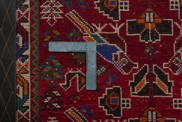 Backside of handmade 2000s Shiraz rug showing knot structure and weave density