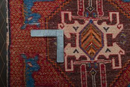 Backside of handmade 2000s Shiraz rug showing knot structure and weave density