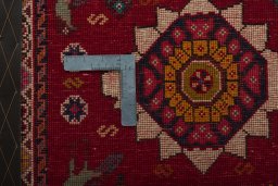 Backside of handmade 2000s Shiraz rug showing knot structure and weave density