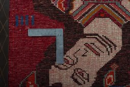 Backside of handmade 2000s Shiraz rug showing knot structure and weave density