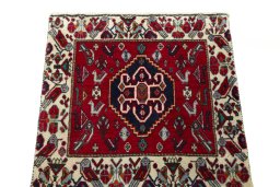 Surface texture of 2000s Shiraz rug with natural Wool and intricate pattern