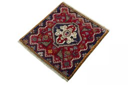 Corner detail of 2000s Shiraz rug showing border pattern and Wool pile