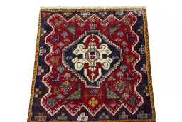 Surface texture of 2000s Shiraz rug with natural Wool and intricate pattern
