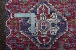 Backside of handmade 2000s Shiraz rug showing knot structure and weave density